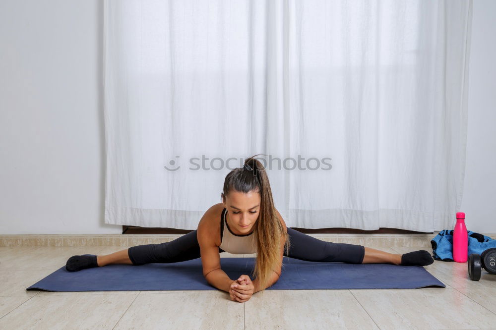 Image, Stock Photo Fit young woman sitting up on yoga mat
