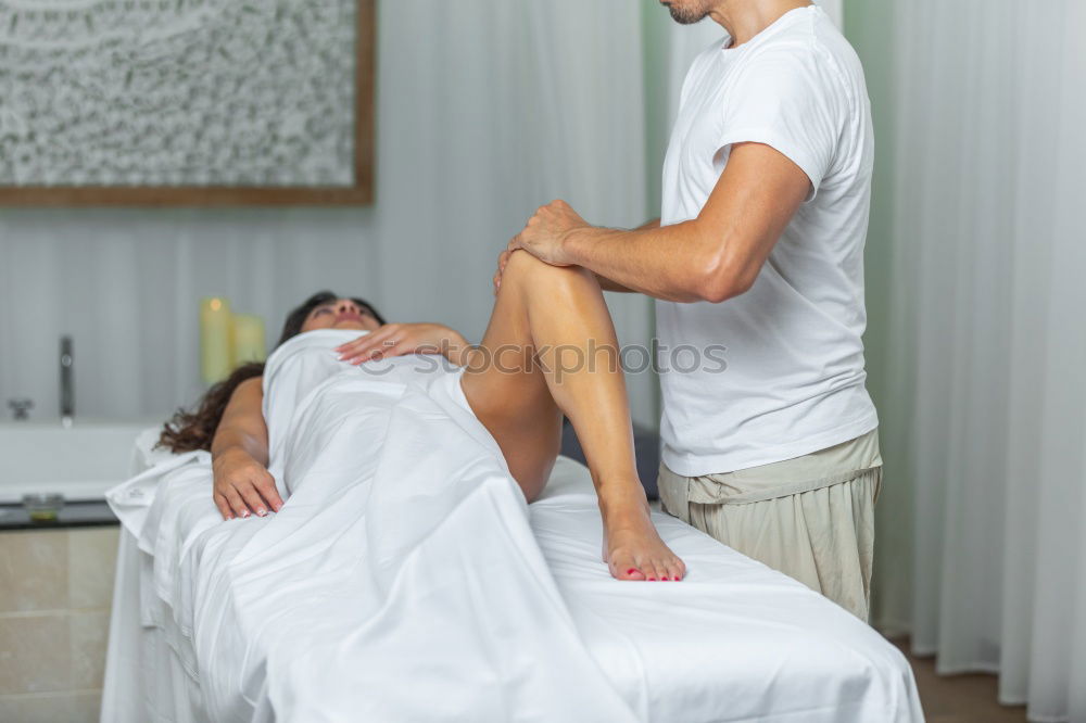 Similar – Massage therapist doing lymphatic drainage treatment to woman