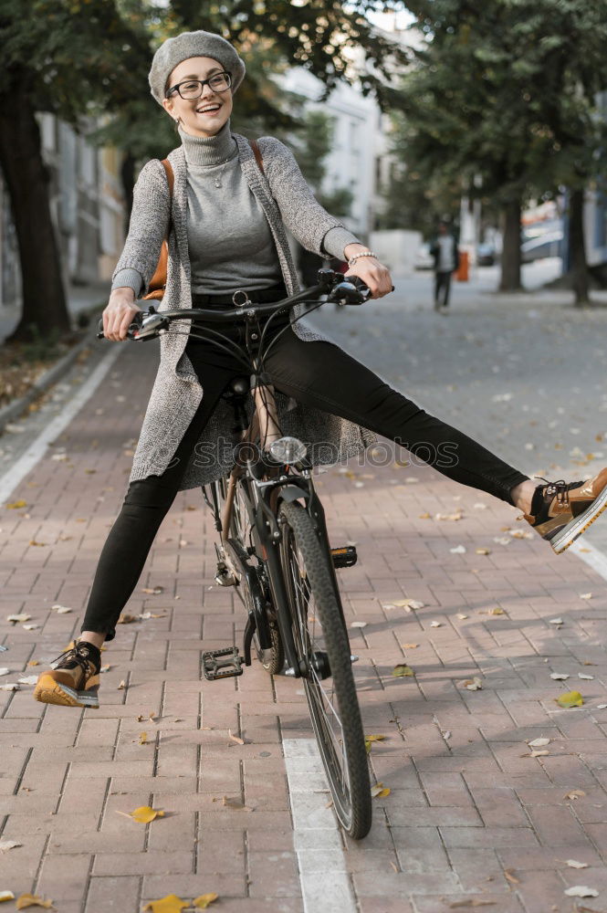 Similar – Handsome afro man walking with his bike.