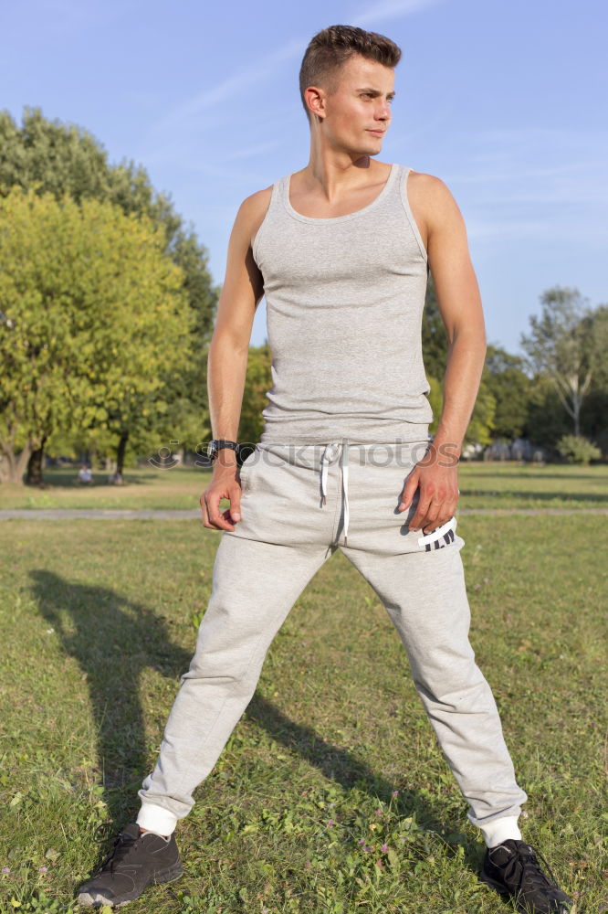 Similar – Fit shirtless young black man doing stretching after running