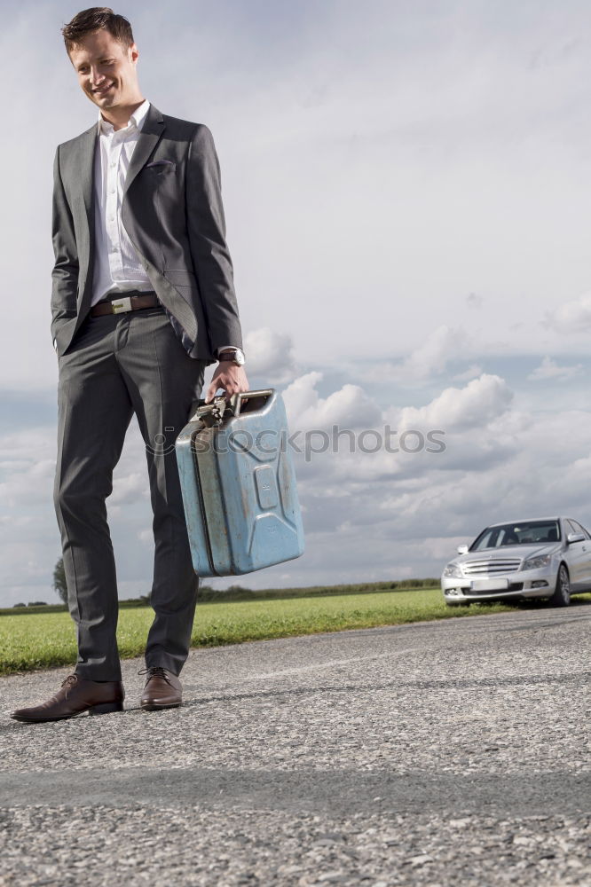 Similar – Image, Stock Photo Young business man standing with the suitcase at the airport waiting for the flight