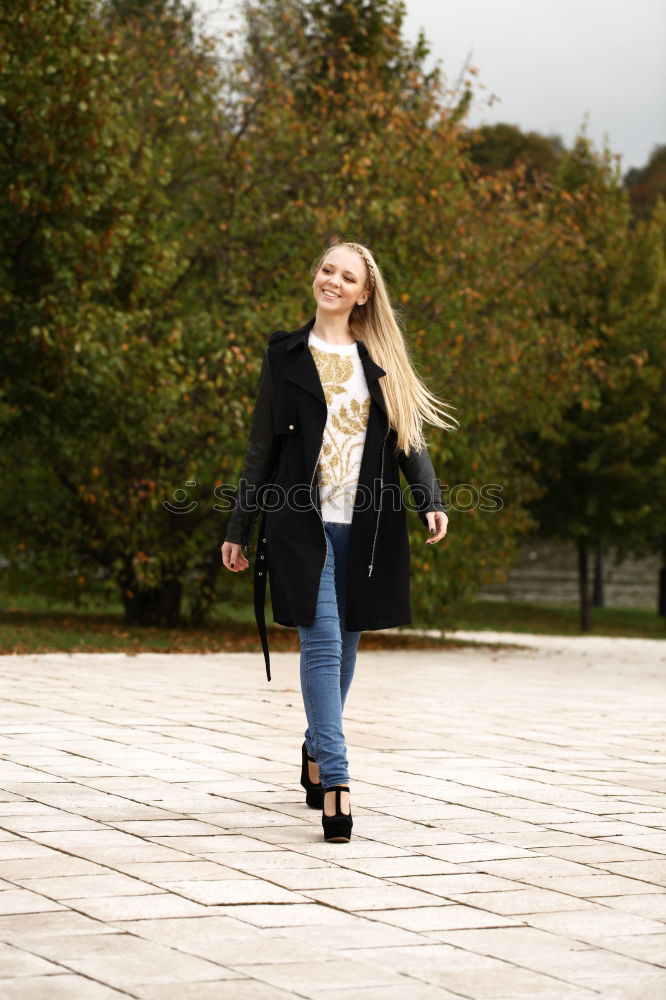 Similar – Woman enjoys sun on park bench