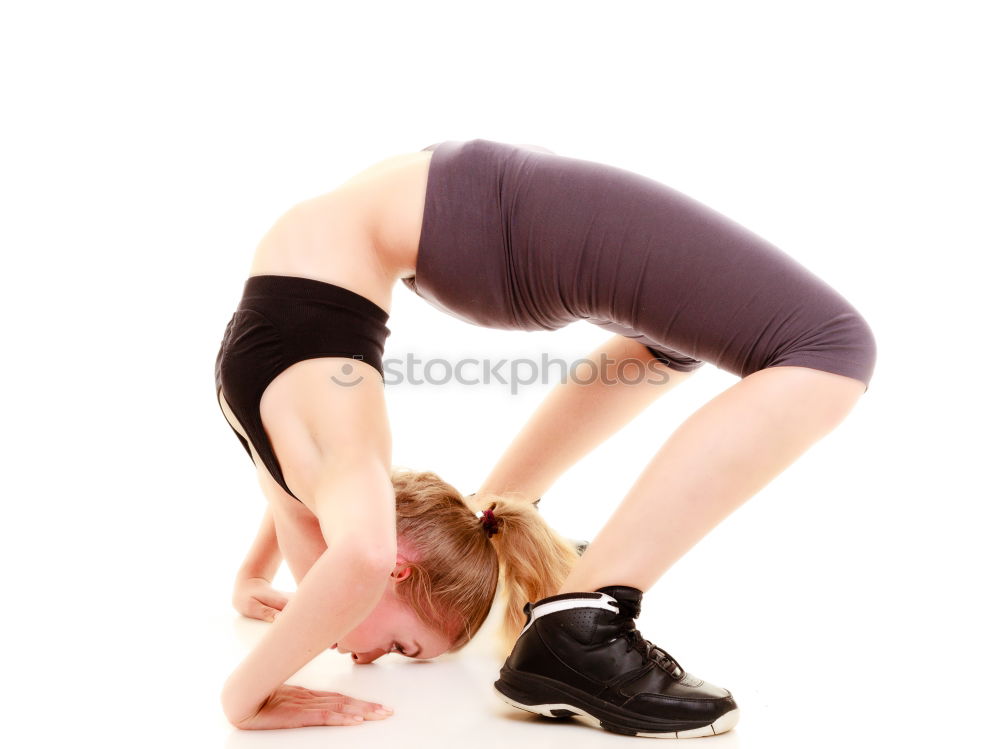 Similar – Woman stretching her body in front of ancient wall in park