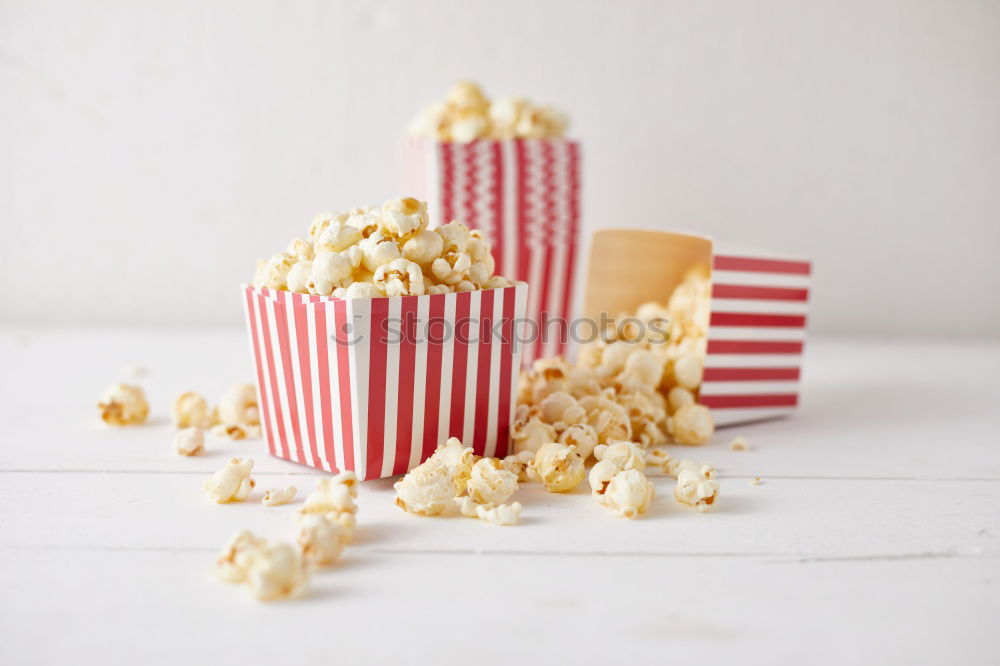 Two popcorn boxes and a red heart