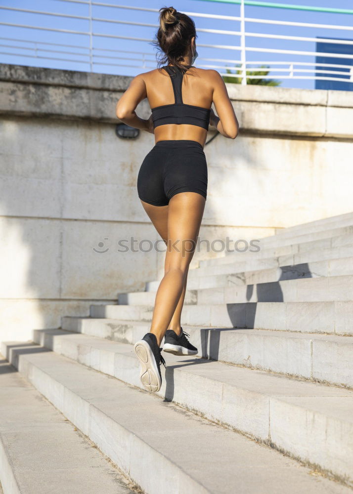 Image, Stock Photo Athletic woman running up stairs during cardio