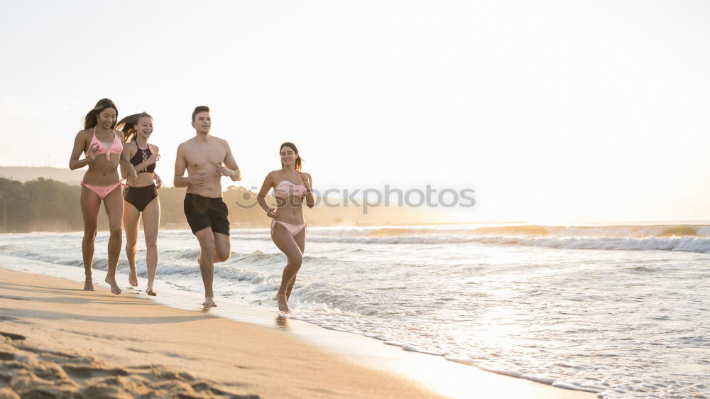 Similar – Image, Stock Photo Friends walking on the beach together on vacation