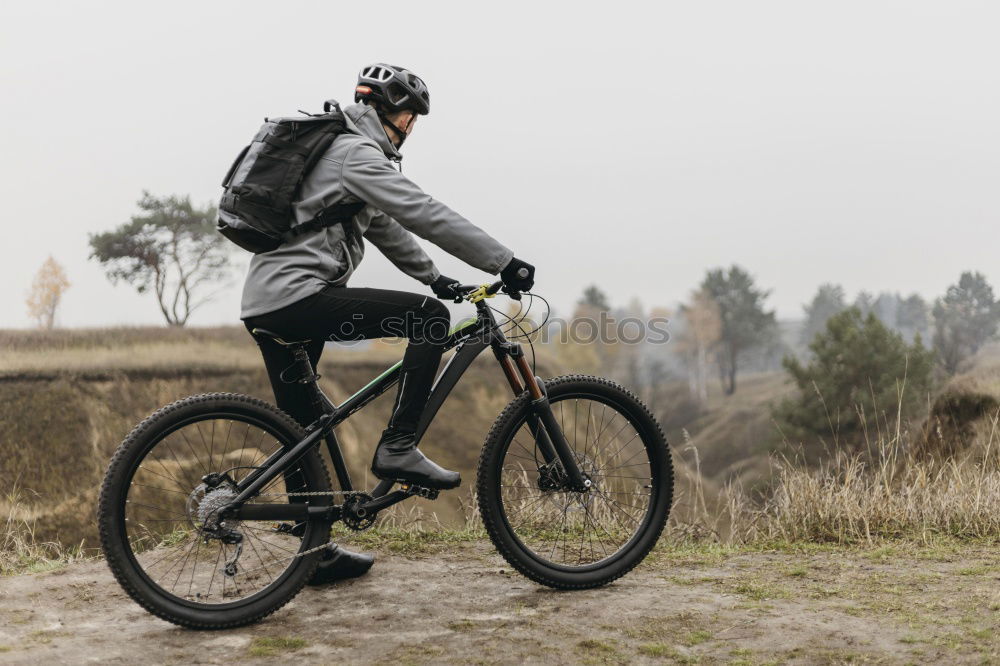 Similar – Image, Stock Photo Man walking with mountain biking