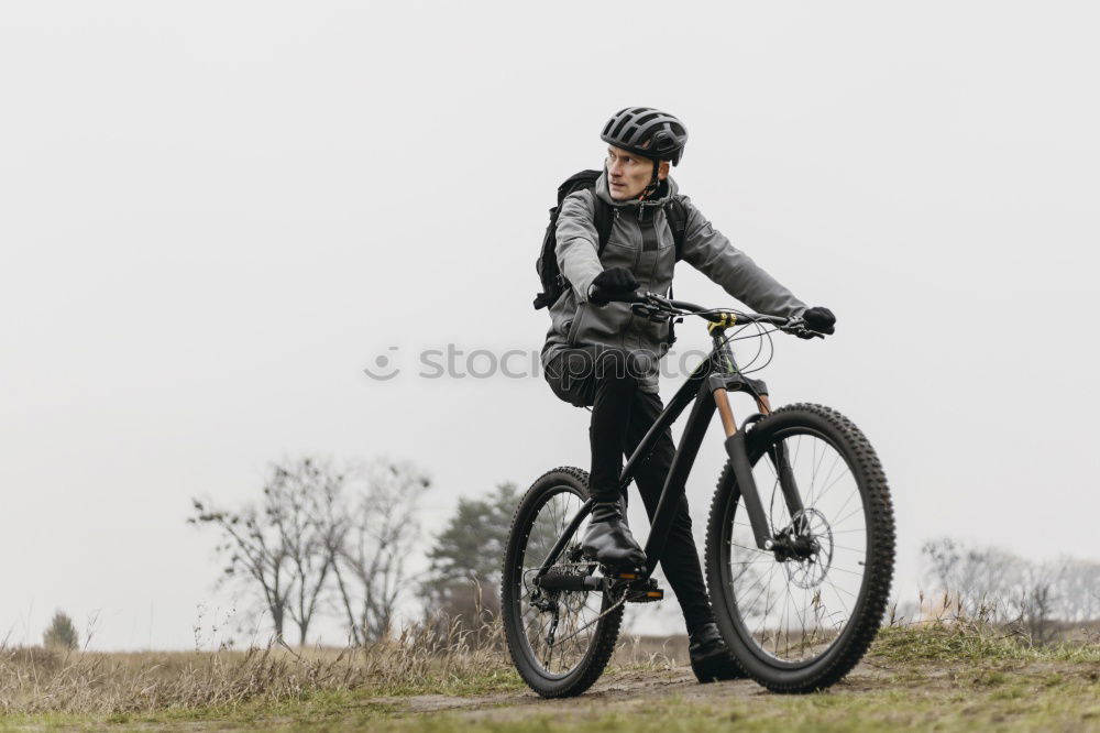 Similar – Image, Stock Photo Sporty young woman in helmet with bicycle looking at camera