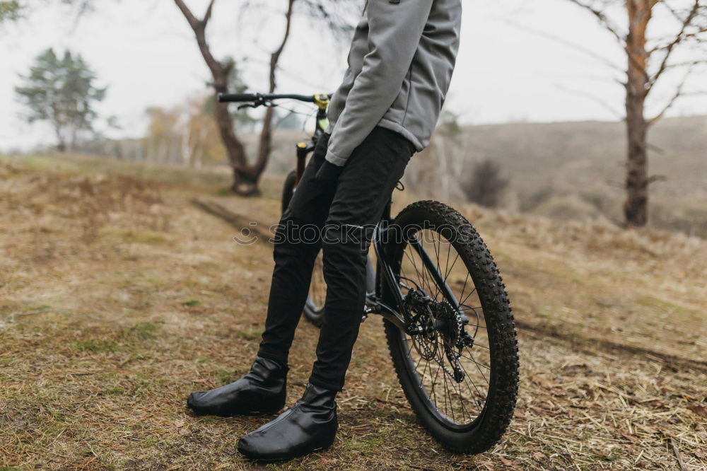 Similar – Image, Stock Photo Man walking with mountain biking