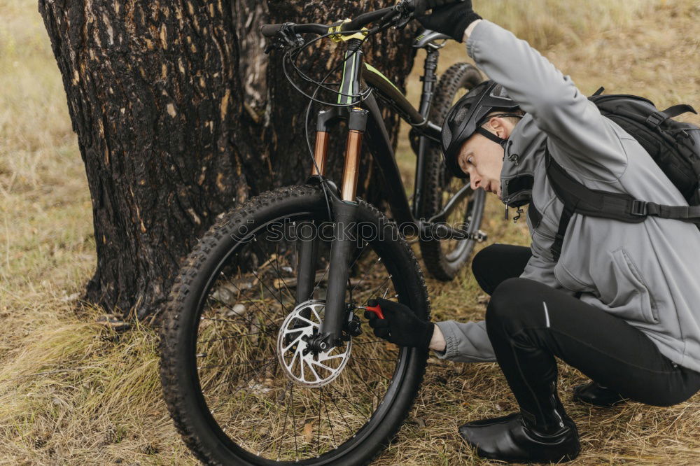 Similar – Image, Stock Photo Man walking with mountain biking