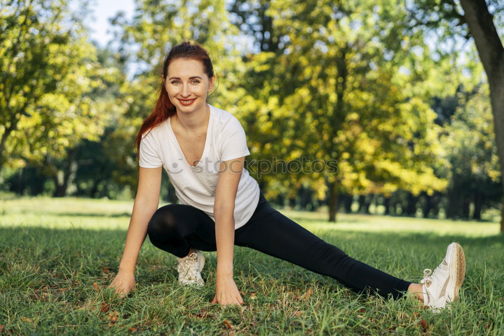 Similar – Athletic young woman doing push up exercises