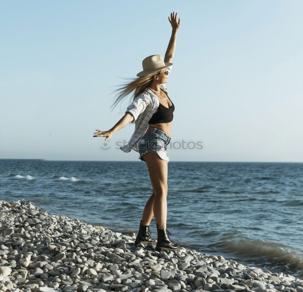 Similar – Image, Stock Photo Beautiful young woman wearing a bikini in a wooden foot bridge at the beach