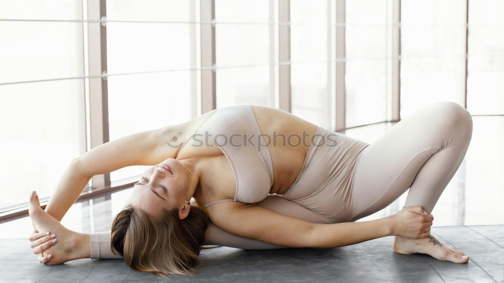 Similar – Group of young sporty sexy women in yoga studio, practicing yoga lesson with instructor, forming a line in Adho mukha svanasana downward dog asana pose. Healthy active lifestyle, working out in gym