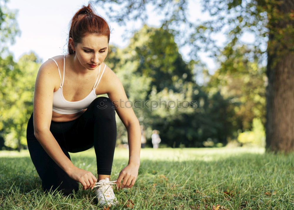 Similar – Woman jogging along a country road while listening to music