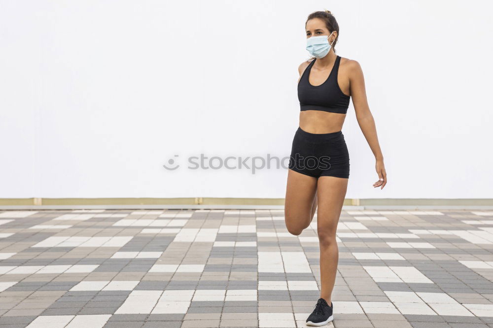 Similar – Young sporty woman doing exercises with a latex band