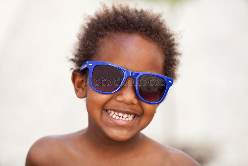 Similar – Cute black boy having fun on a swing in his parents garden