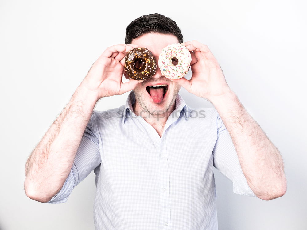 Similar – Image, Stock Photo Caucasian women making funny face with chocolate donuts