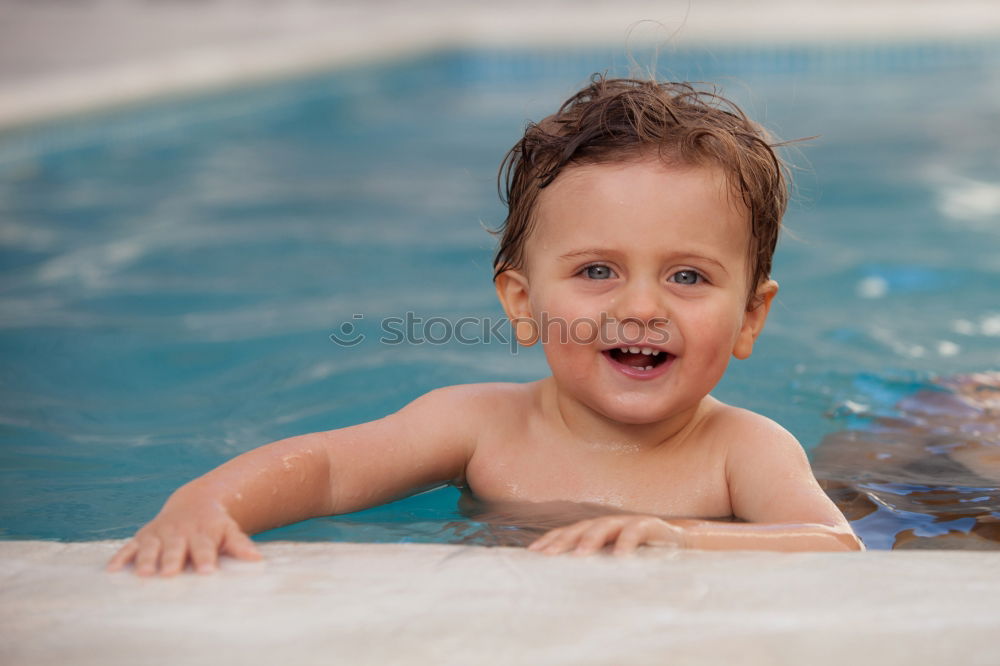 Similar – Kid in snorkel mask posing on poolside