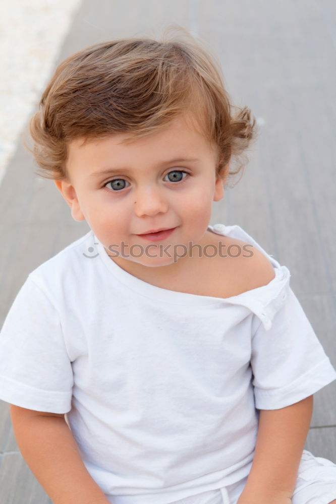 Similar – Image, Stock Photo Portrait of a three year-old boy sitting on the curb and looking left