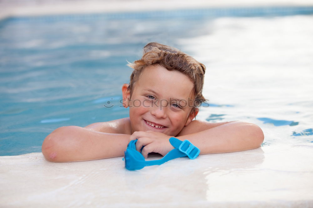 Similar – Kid in snorkel mask posing on poolside