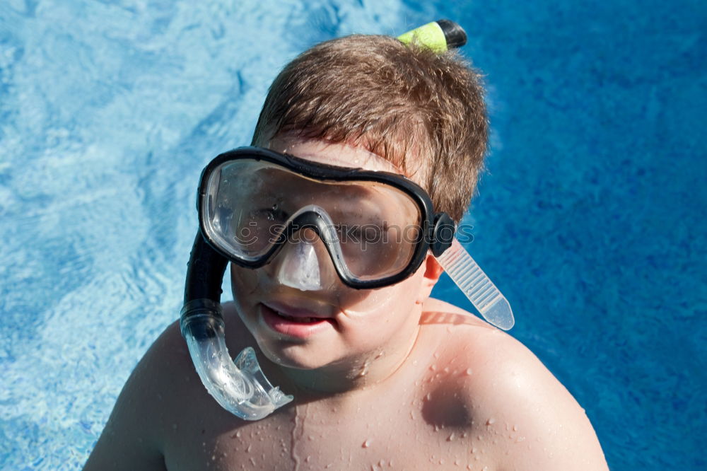 Similar – One little happy boy playing on the inflatable circle in swimming pool at the day time. Concept of friendly family.