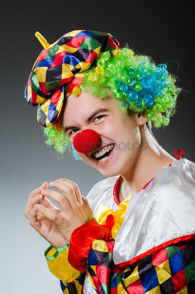 Similar – Young man wearing a clown costume