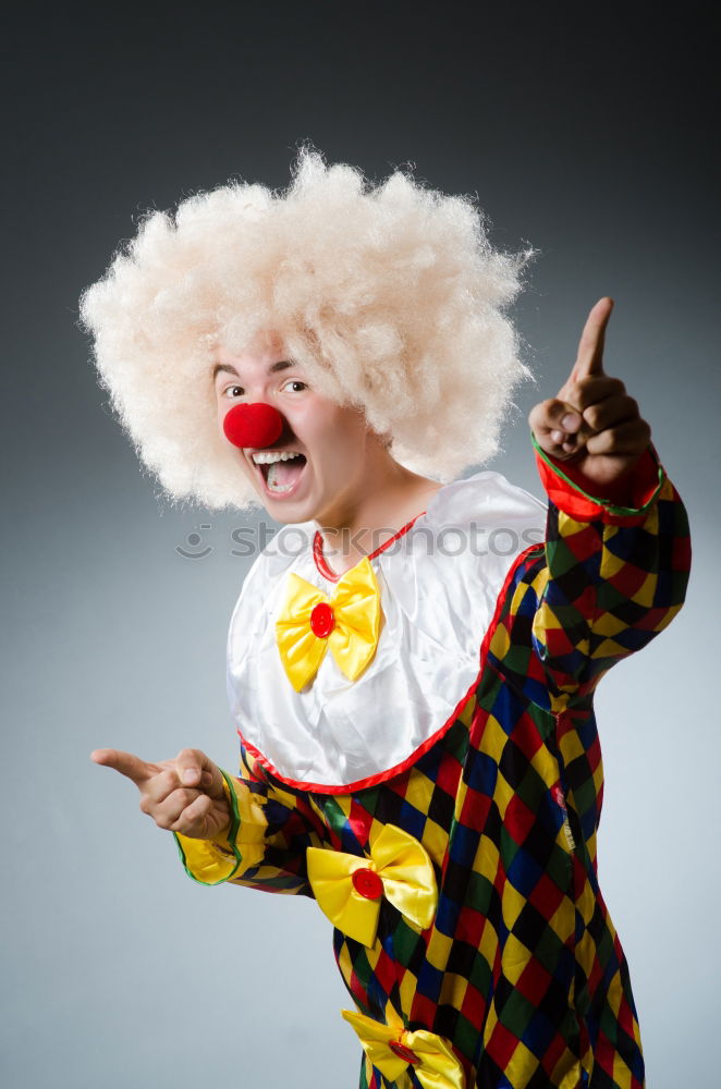 Similar – Young man wearing a clown costume