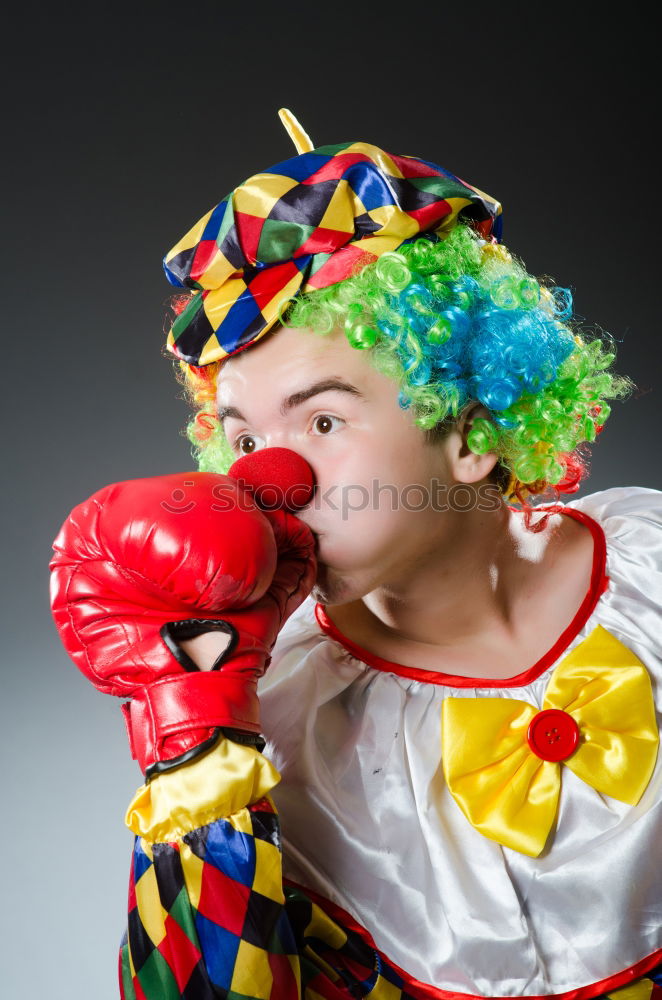 Similar – Young man wearing a clown costume