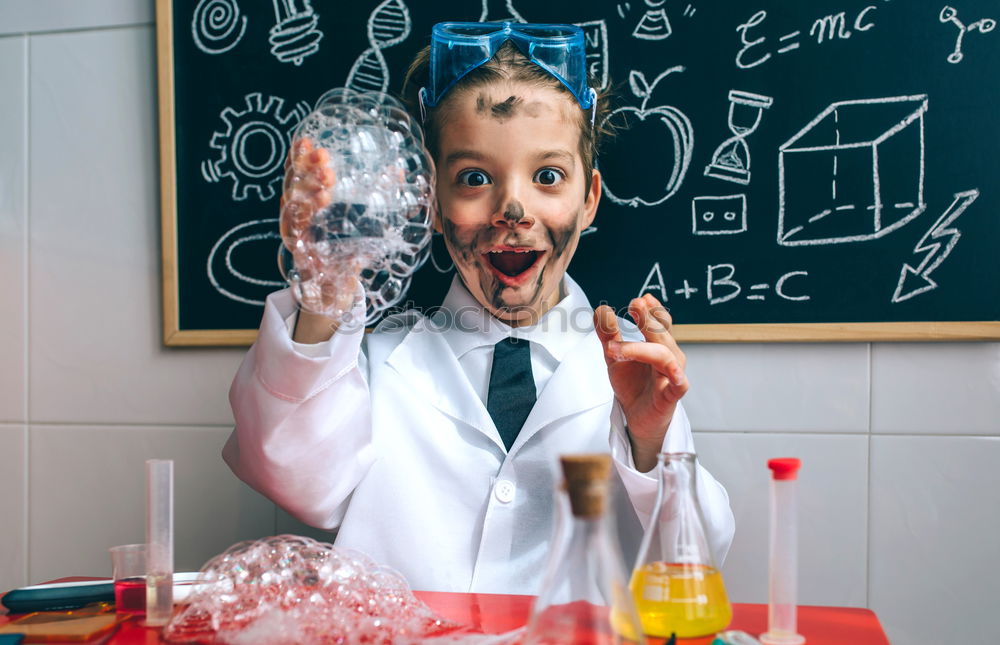 Similar – Child dressed as a scientist and chalkboard