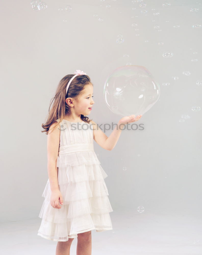 Similar – Image, Stock Photo Girl blowing balloon outside