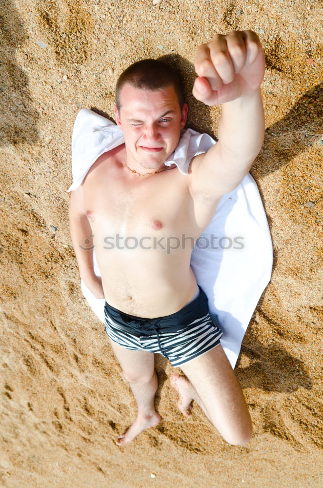 Young man having fun at the beach