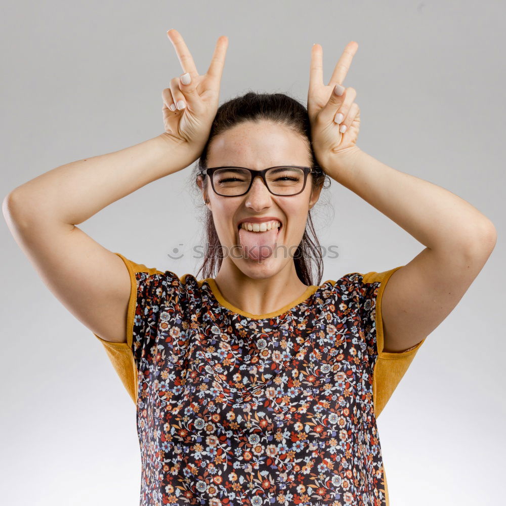 Similar – woman covering her eyes with pieces of sushi