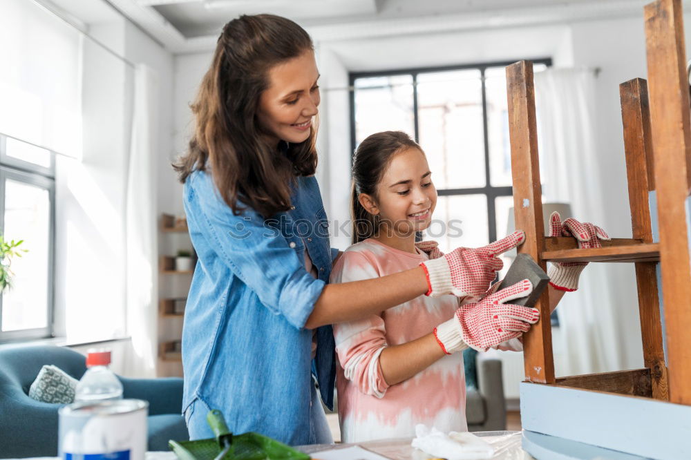 Similar – Image, Stock Photo Little girl cooking with her mother in the kitchen.