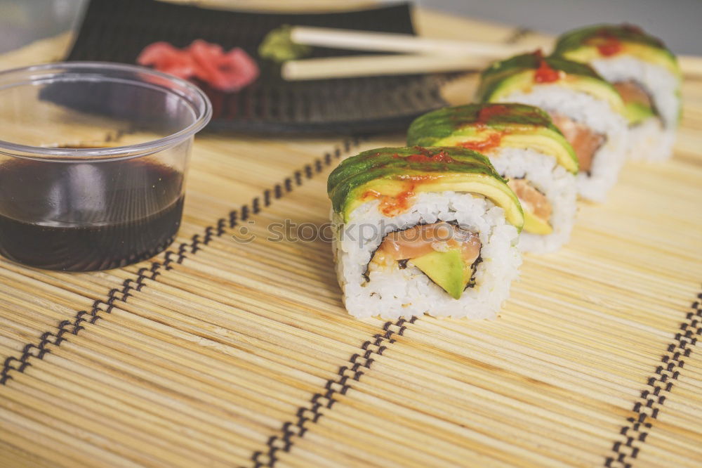 Similar – Crop woman eating sushi