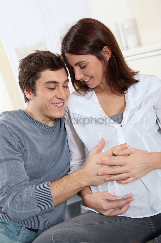 Similar – Image, Stock Photo Happy pregnant couple feeling the movements of their baby