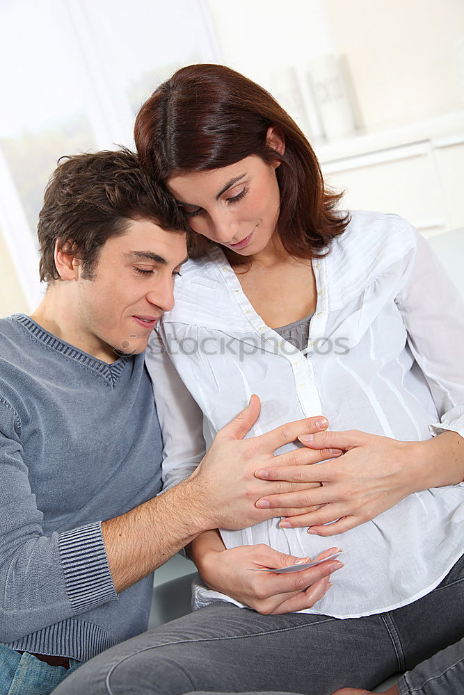 Similar – Image, Stock Photo Happy pregnant couple feeling the movements of their baby