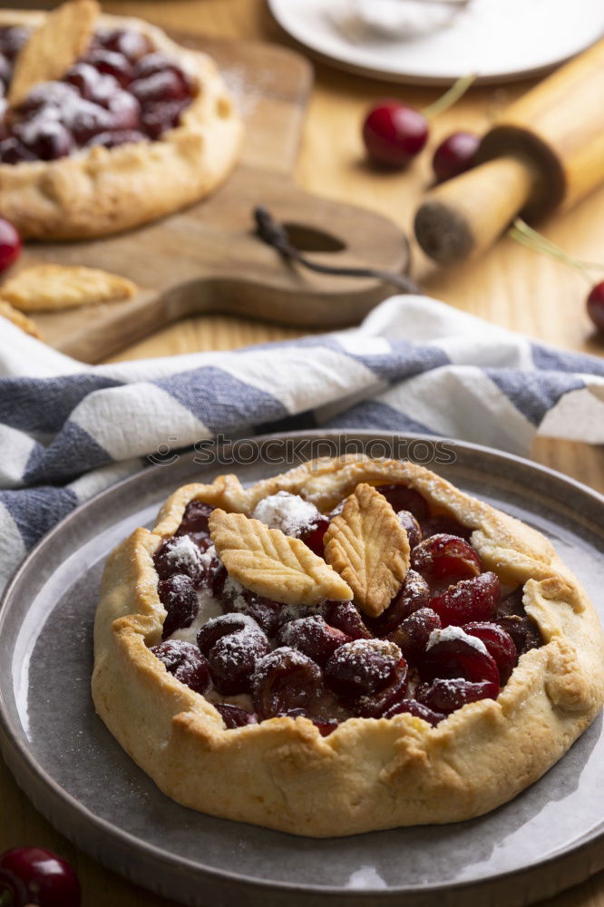 Similar – Delicious tartlets with raspberries and blueberries