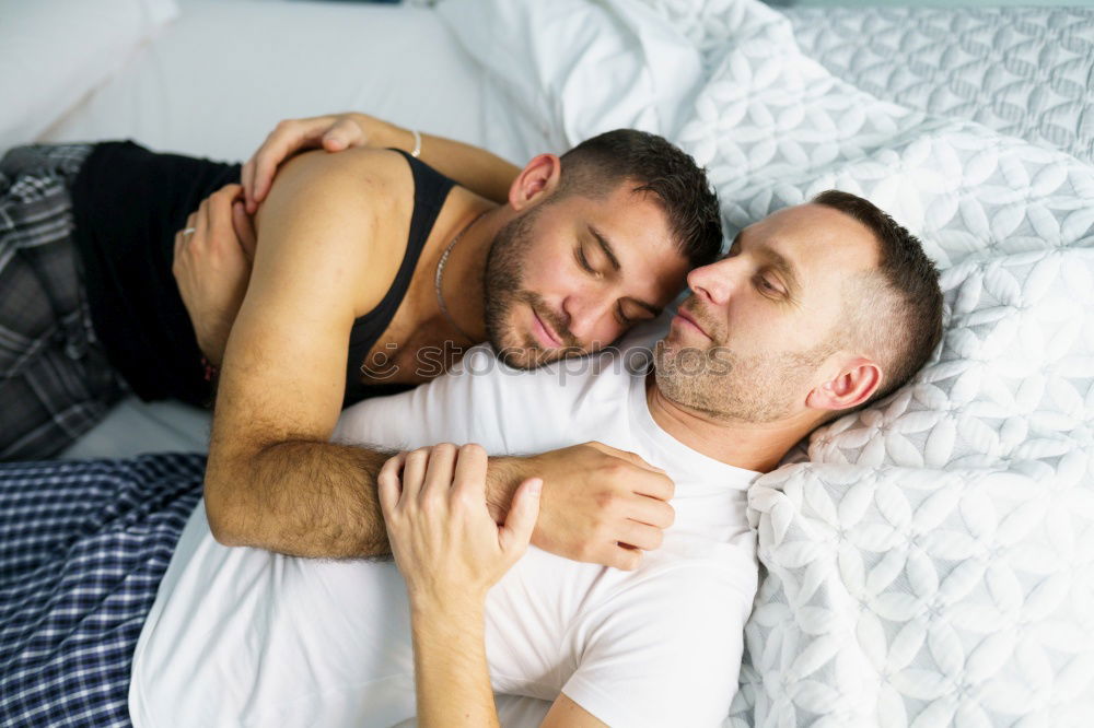 Similar – Gay couple sleeping in each other’s arms.