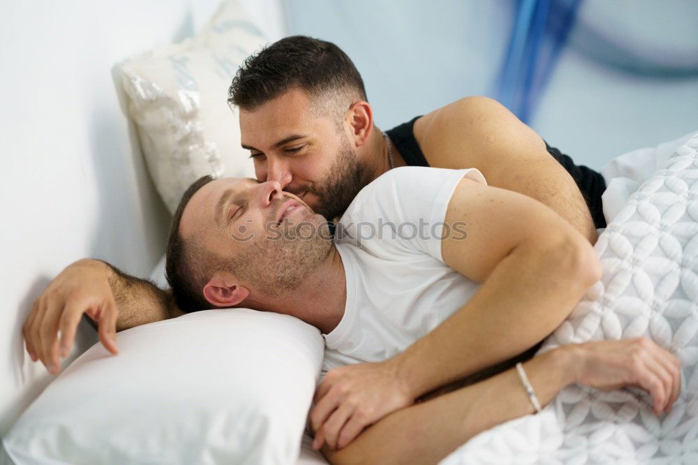 Similar – Gay couple sleeping in each other’s arms.