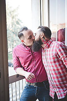 Similar – Embracing and laughing gay couple