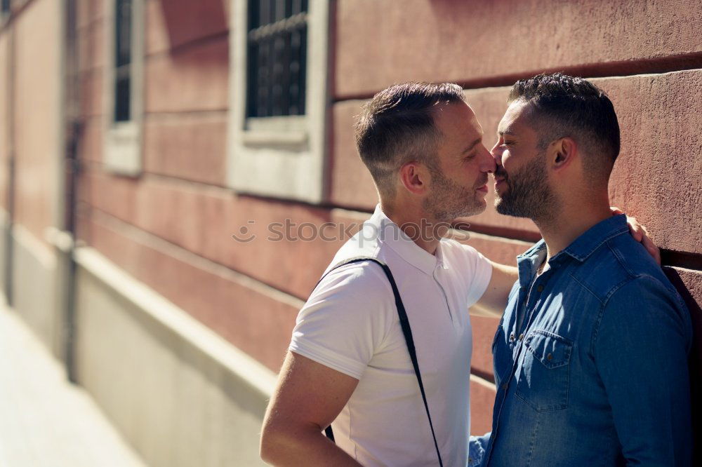 Similar – Embracing and laughing gay couple