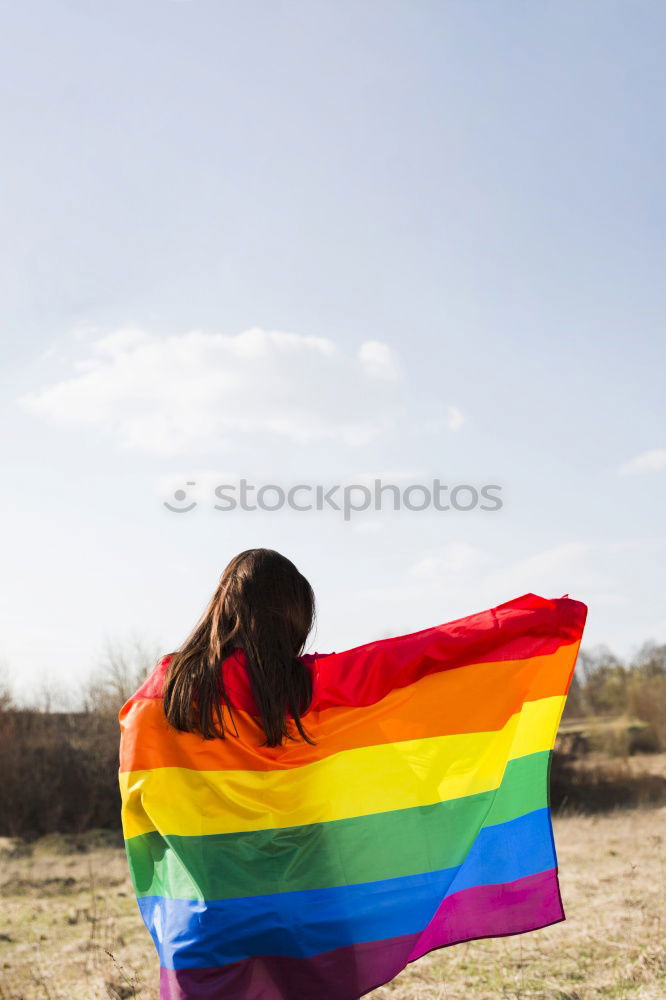 Image, Stock Photo Woman holding the Gay Rainbow Flag on green meadow outdoor