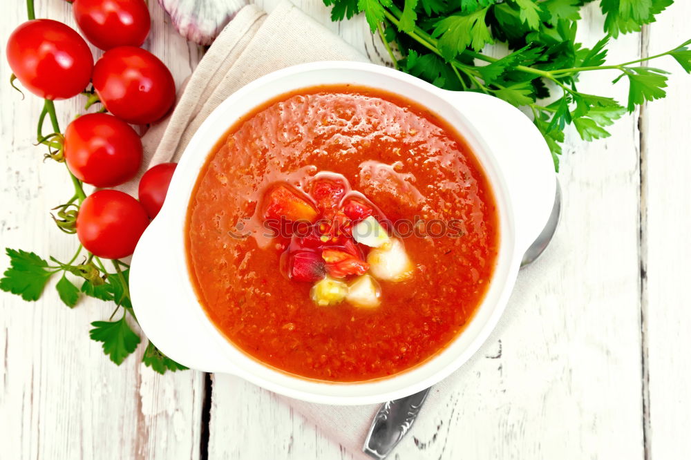 Similar – Fresh tomato soup with ingredients