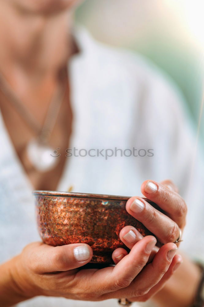 Similar – Image, Stock Photo Hand playing yoga bowls outdoors.