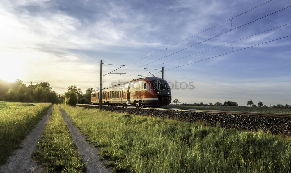 Similar – Image, Stock Photo High-speed train moving through nature at sunset