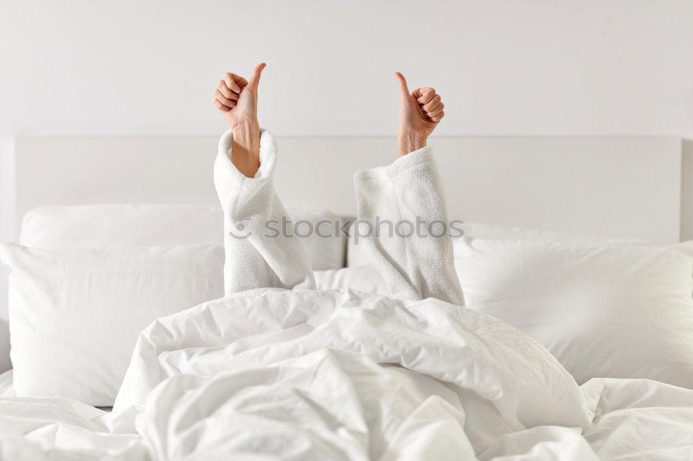 Similar – Image, Stock Photo A bed with two feet coming out of the sheets