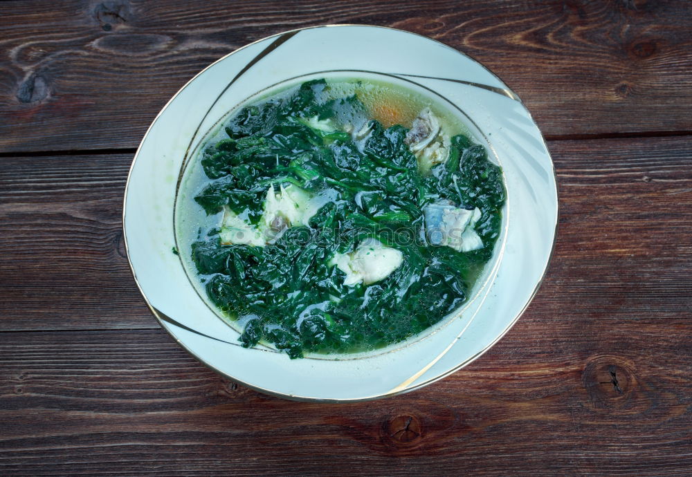 Similar – Spinach in cream sauce in casserole dish with spoon