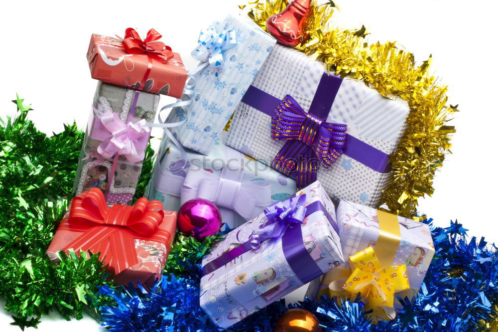 Similar – Image, Stock Photo Two gift wrapped in paper with a red ribbon on a white plate