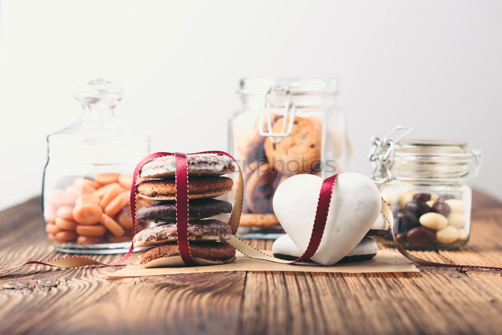 Image, Stock Photo Gingerbread cookies, candies, cakes in jars on wooden table