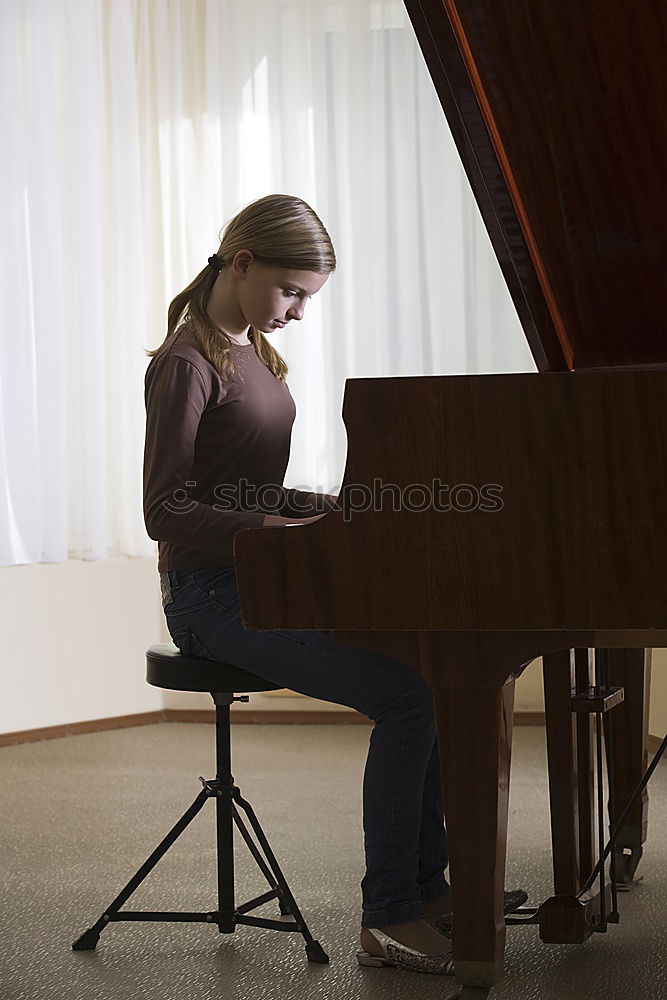 Similar – Image, Stock Photo young woman holding playing piano at home